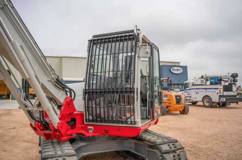 Takeuchi excavator fitted with bolt-on cab guard for forestry and brush clearing work