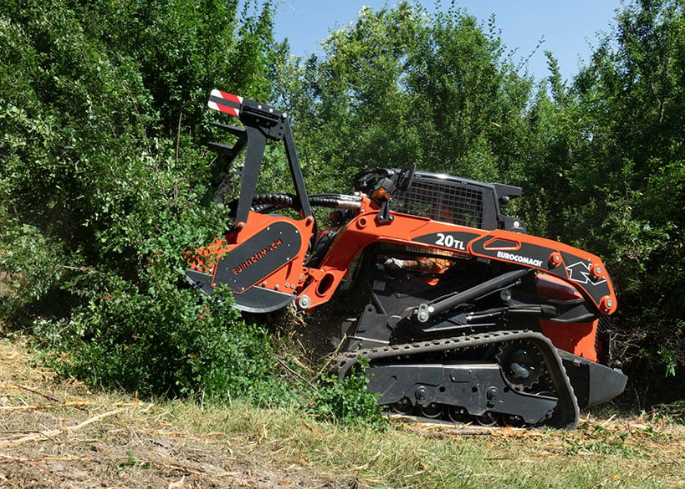 Eurocomach 20TL forestry skid steer with mulcher attachment clearing brush and vegetation