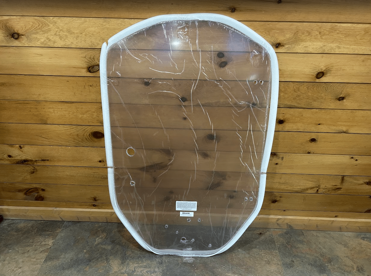 ASV Max-Series polycarbonate windshield replacement, front view showing pre-drilled mounting holes and clear lexan panel