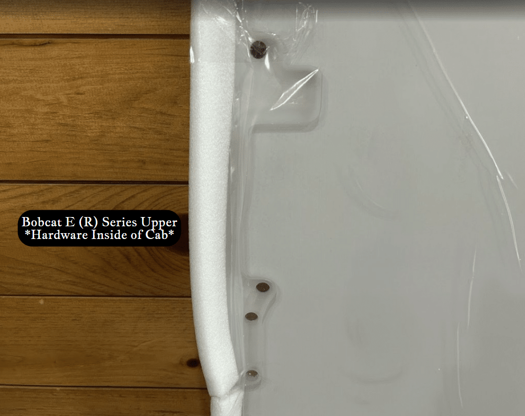 Left edge detail of Bobcat E (R) Series upper windshield showing foam seal strip and side mounting hardware studs