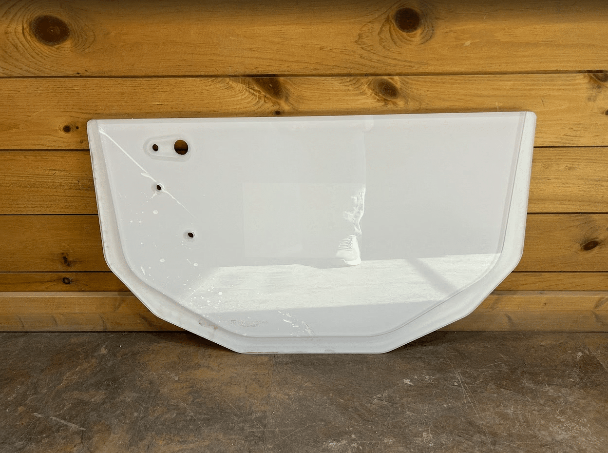 Bobcat E Series excavator lower polycarbonate windshield replacement, front view showing D-shape panel with pre-drilled mounting holes