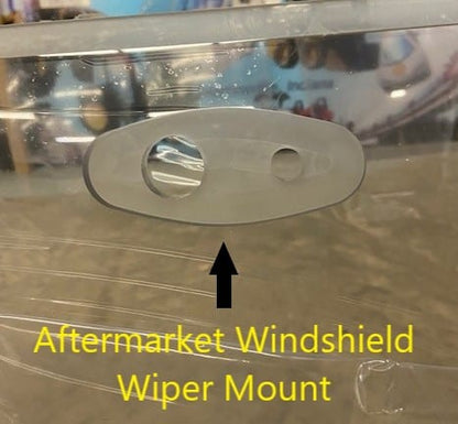 Close-up of Bobcat G Series aftermarket polycarbonate windshield showing the wiper mount location, annotated with yellow text overlay