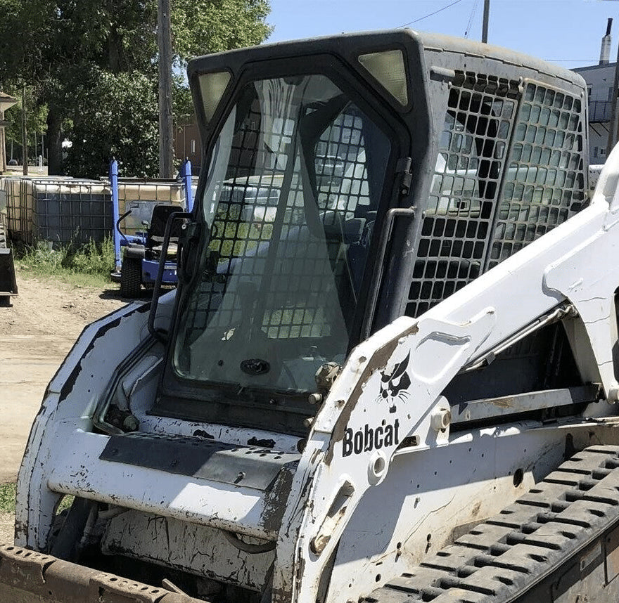 White Bobcat G Series skid steer with cab door open showing original OEM glass windshield before replacement