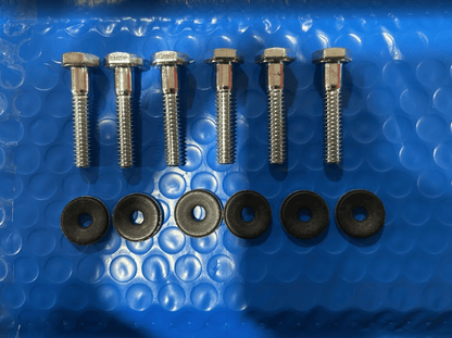 Bobcat M Series side window mounting hardware kit showing 6 hex bolts and 6 rubber washers on bubble wrap