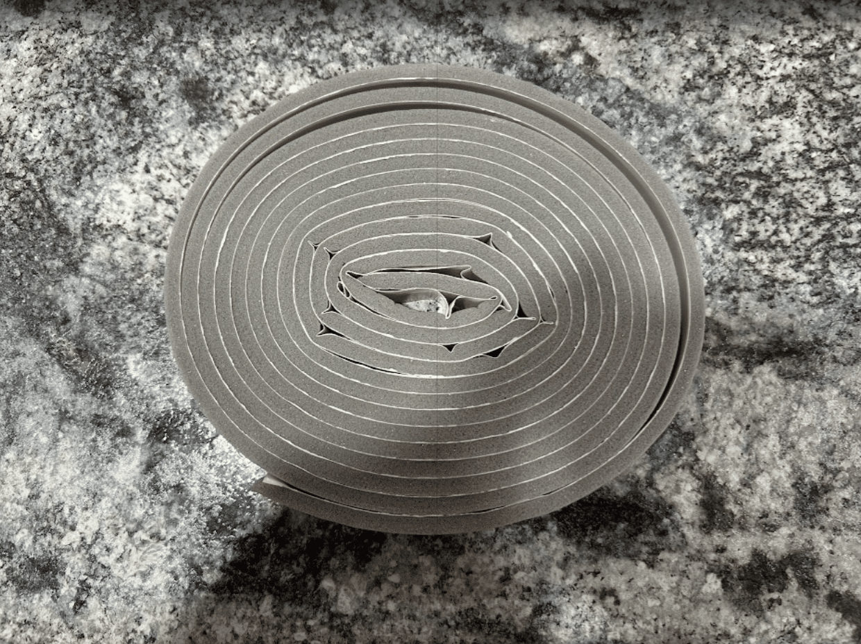 Close-up of rubber seal gasket coil used on Bobcat M Series polycarbonate side window perimeter frame