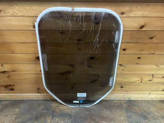 Bobcat M Series 50% tinted polycarbonate windshield replacement only, front view showing white perimeter frame and protective film