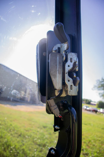 Bobcat R Series door frame close-up of latch striker plate and lock mechanism, works with existing factory hardware