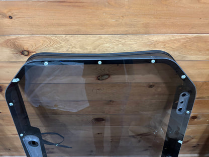 Bobcat R Series door frame overhead view showing frame corners, perimeter mounting bolts, and hinge barrel assembly