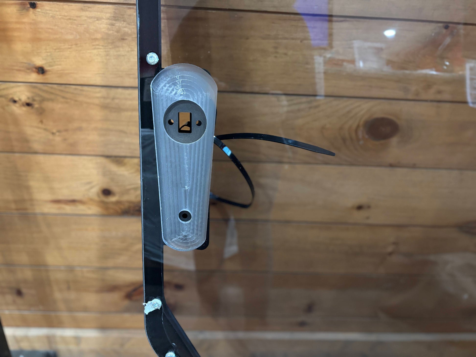 Bobcat R Series door frame wiper motor mount close-up showing motor housing and wiring, factory-compatible design