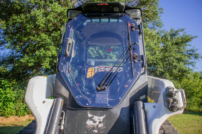 Bobcat R Series skid steer with new frame and windshield assembly installed, overhead exterior view outdoors