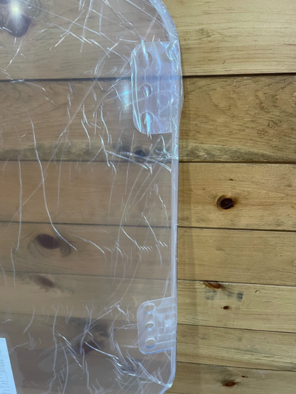 Top corner of Bobcat R Series polycarbonate windshield showing mounting hardware and clear panel