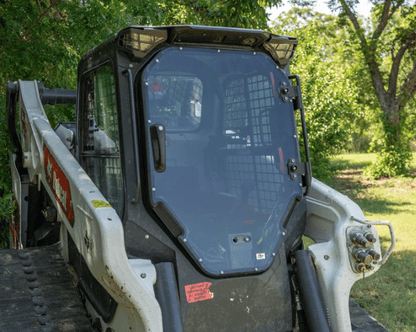 Bobcat T86 tracked skid steer with tinted R Series windshield and door installed, photographed outdoors