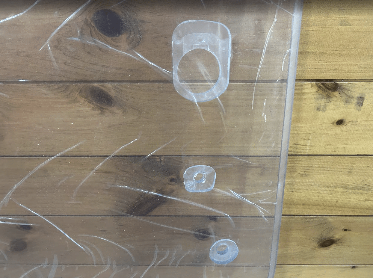 Close-up of mounting hole grommets on the Case DL550 TV620B Minotaur polycarbonate windshield replacement