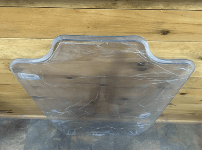 Close-up of the top edge of the Case DL550 TV620B Minotaur polycarbonate windshield showing the distinctive notched shape
