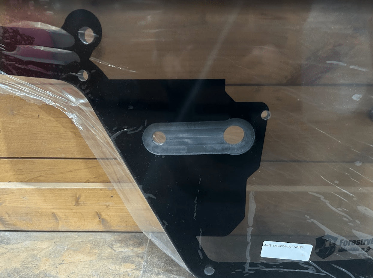 Close-up of Case/New Holland forestry door black wiper hinge bracket with mounting slots and Forestry Doors product label