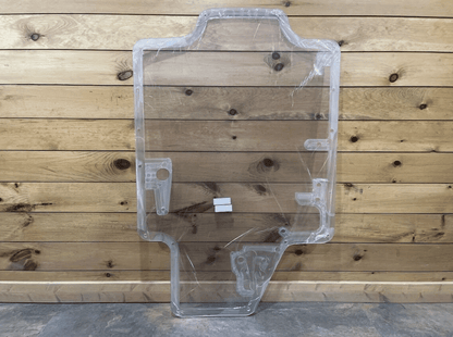 Case/New Holland SR/TR/SV/TV Series clear polycarbonate forestry door showing wiper motor bracket housing, full front view