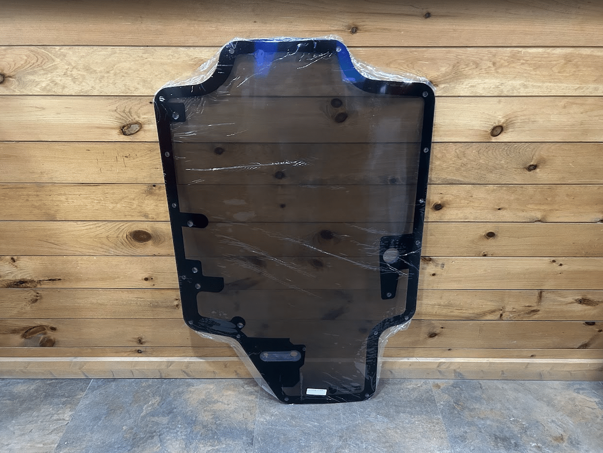 Case/New Holland SR/TR/SV/TV Series tinted polycarbonate forestry door replacement with black rubber frame, full front view