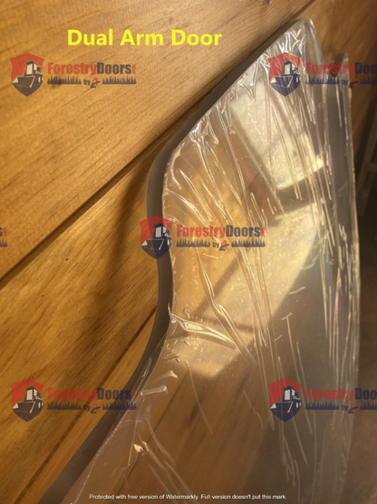 Close-up of Case SR TR SV TV Series dual arm door polycarbonate windshield edge, protective film still applied