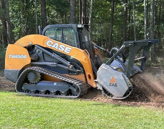 Case TV450B compact track loader with FAE stump grinder attachment working in a forested area