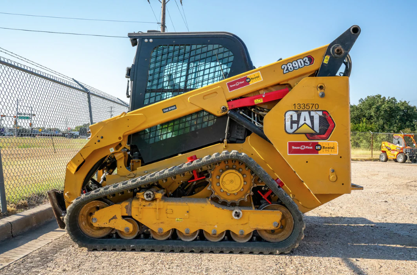 Caterpillar 289D3 compact track loader parked at a rental equipment yard