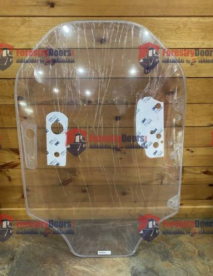Caterpillar D Series clear polycarbonate windshield replacement panel with protective film and mounting hardware tags on wooden background