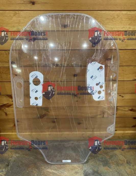 Caterpillar D Series clear polycarbonate windshield replacement panel with protective film and mounting hardware tags on wooden background