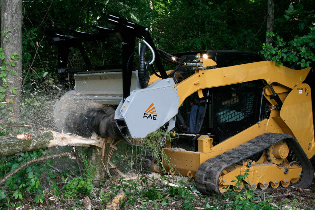 Compact track loader running a forestry mulcher, the kind of work that breaks factory skid steer door glass