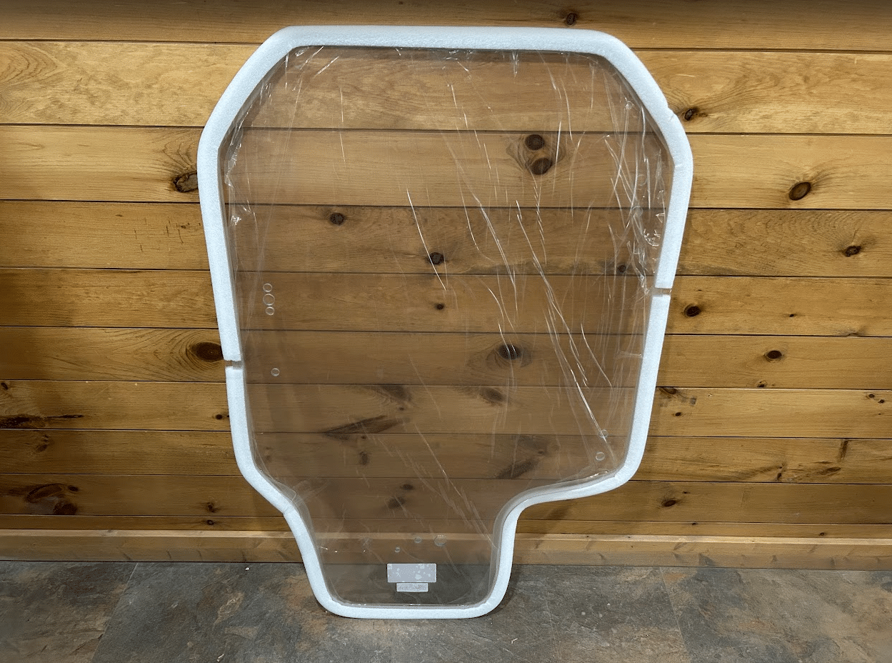 Front view of Gehl R and RT series clear polycarbonate windshield replacement with protective film