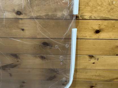 Close-up of the white right side frame and mounting holes on John Deere G Series small frame polycarbonate windshield