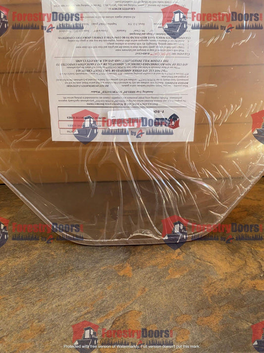 John Deere G Series small frame polycarbonate windshield in orange cardboard shipping packaging with instruction label