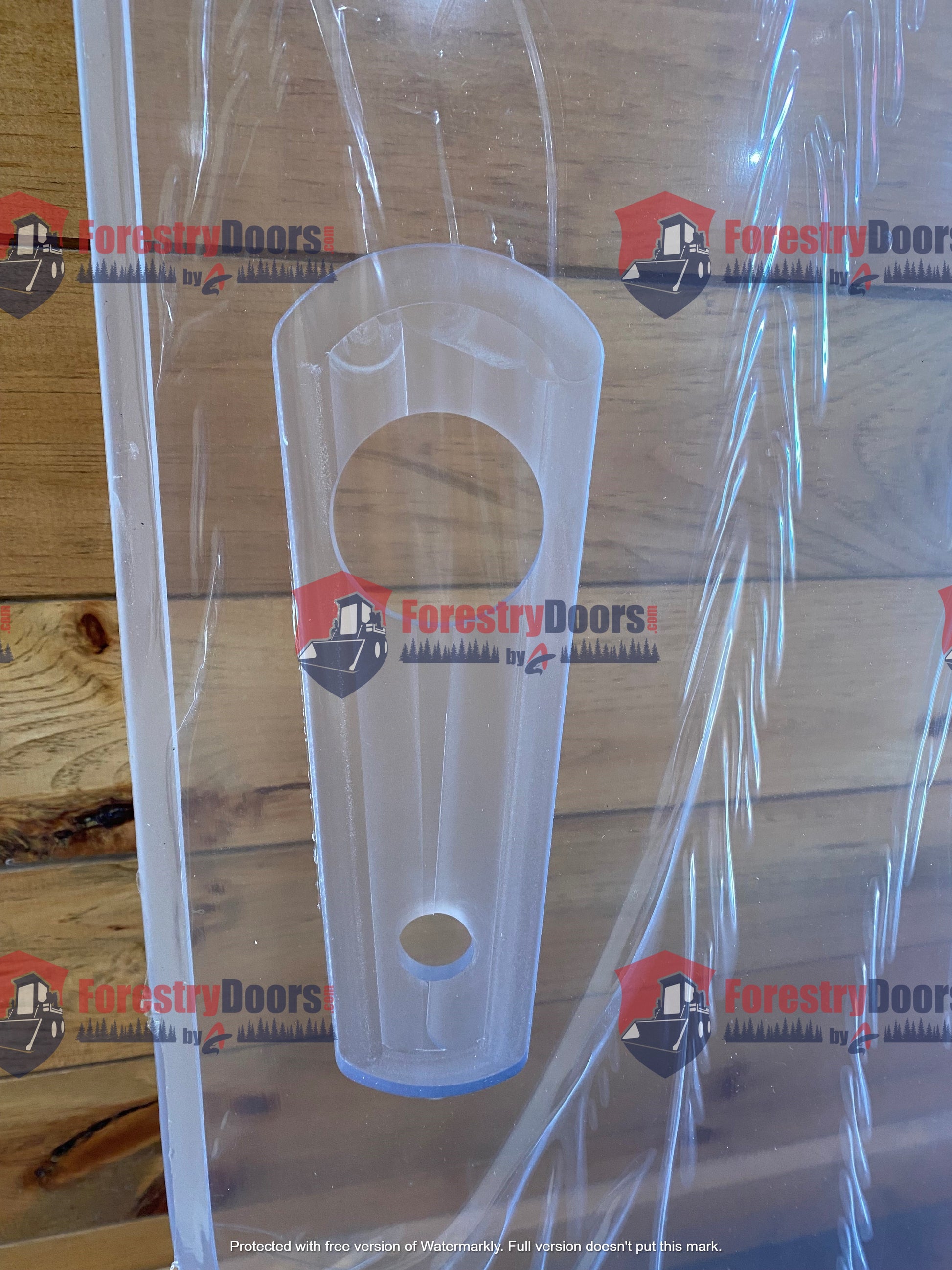 Close-up of the latch slot and mounting hardware area on a John Deere G Series polycarbonate windshield