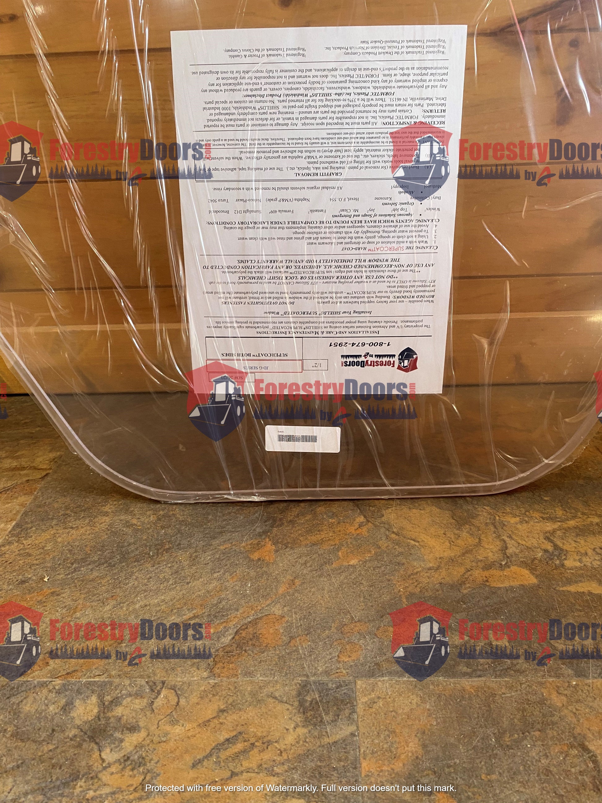 Back of John Deere G Series polycarbonate windshield showing product information label