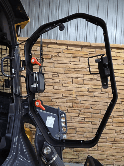 John Deere P Series skid steer cab door opening showing latch hardware before windshield installation