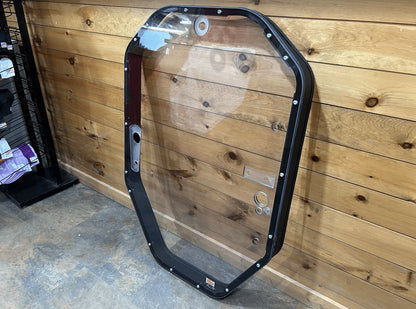 John Deere P Series windshield frame assembly angled view showing red foam door seal strip