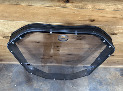 John Deere P Series windshield frame assembly rear view showing frame and mounting bolts along top edge