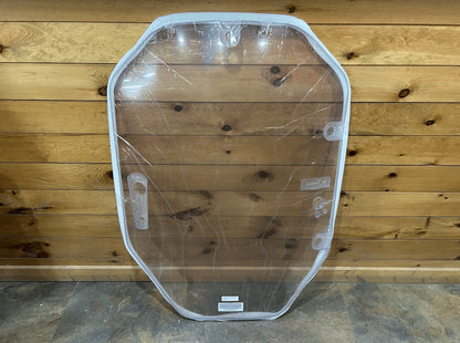 John Deere P Series polycarbonate windshield front view, clear with protective film, shown against wood wall