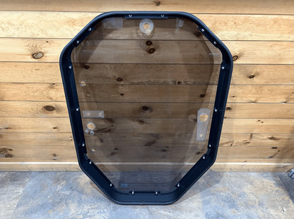 John Deere P Series tinted windshield frame assembly full front view with latch hardware on both sides