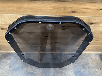 Rear view of tinted John Deere P Series windshield frame assembly showing back of tinted panel and mounting grommet