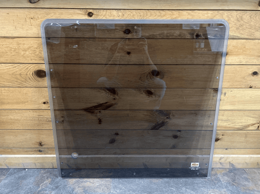 Kubota KX080-4 excavator polycarbonate windshield panel with metal fastening frame, front view