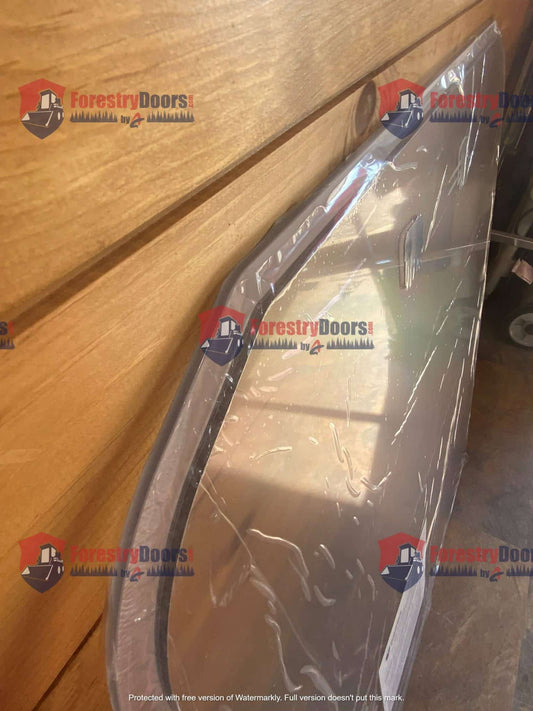 Side edge close-up of Kubota SSV polycarbonate front windshield showing curved profile and protective wrap