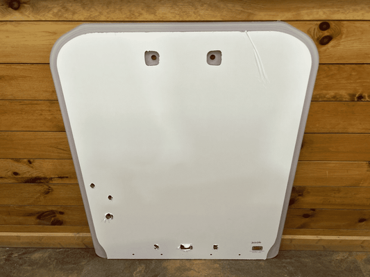 Kubota SSV65 and SSV75 skid steer polycarbonate windshield replacement panel shown from the front against a wood wall