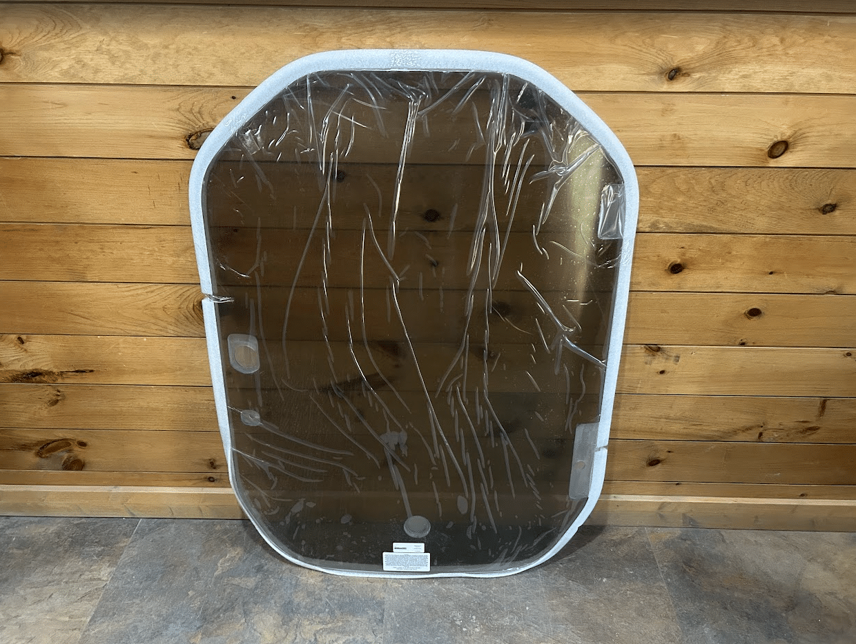Wacker Neuson ST/SW tinted polycarbonate windshield replacement shown from the front with protective film